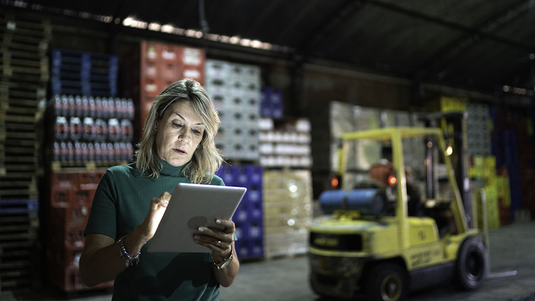 Woman-Using-Digital-Tablet-at-Warhouse.jpg